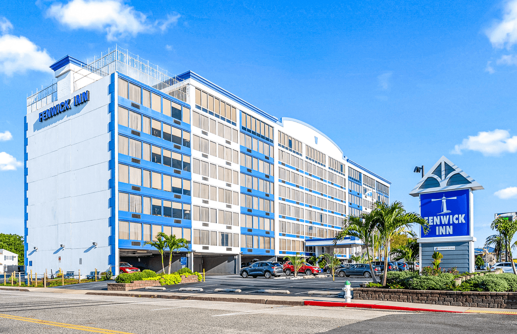 a large blue and white building sitting on the side of a road